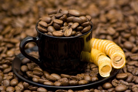cup full of coffee beansの写真素材