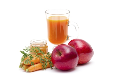 glass of fresh carrots juice with apple and honeyの写真素材