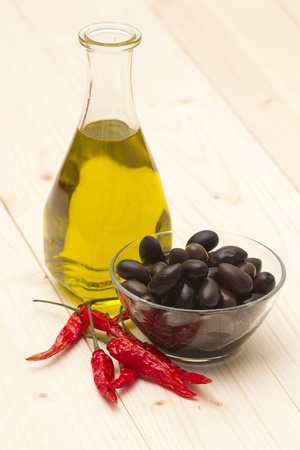 olive oil, black olives, chili peppersの写真素材