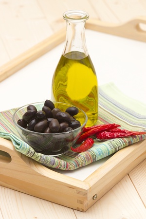 olive oil, black olives, chili peppersの写真素材
