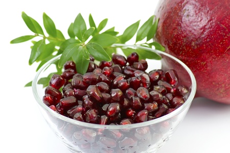 bowl full of fresh pomegranateの写真素材
