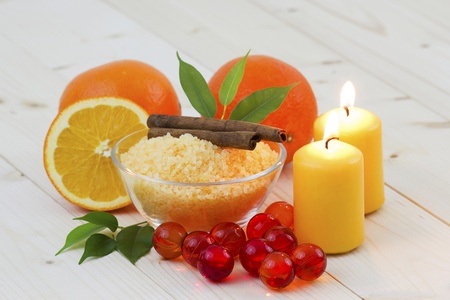 bowl of orange bath salt with fresh fruits - beauty treatmentの写真素材