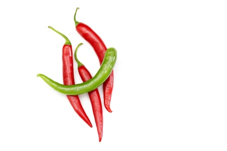 Red hot chili peppers on white background