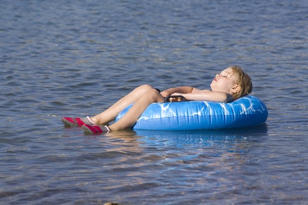 the little girl relaxing on waterの写真素材