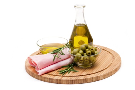 ham, green olives, olive oil and rosemary の写真素材