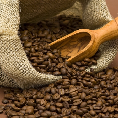coffee beans in burlap sackの写真素材