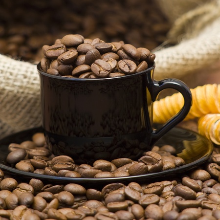 cup full of coffee beansの写真素材