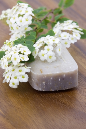 bar of natural soap and white flowersの写真素材