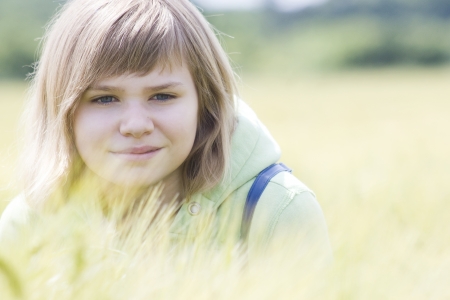 portrait of a little girl in the field of barleyの写真素材