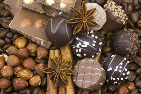 background with chocolate, coffee, spices and nuts