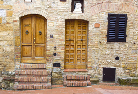 lovely tuscan doors, San Gimignano, Italyの写真素材