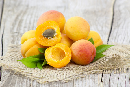 fresh apricots on wooden backgroundの写真素材