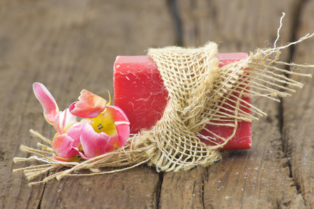 bar of natural soap and tulip flowerの写真素材