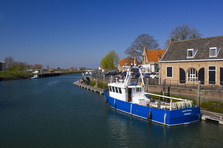 ZIERIKZEE, THE NETHERLANDS - APRIL 11, 2019: Harbour Of Zierikzee with boatsのeditorial素材
