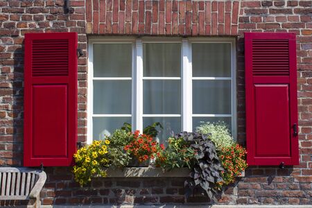 Old German house with window with wooden shutters, Wachtendonk, North-Rhine Westphalia, Germanyの写真素材