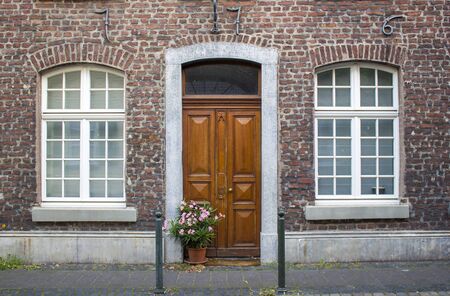 Old German house with wooden door and windows, Wachtendonk, North-Rhine Westphalia, Germanyの写真素材