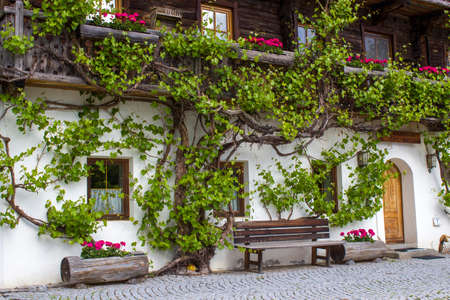 A traditional Austrian mountain farm house in the alpine village of Doelsach, East Tyrol, Austriaの写真素材