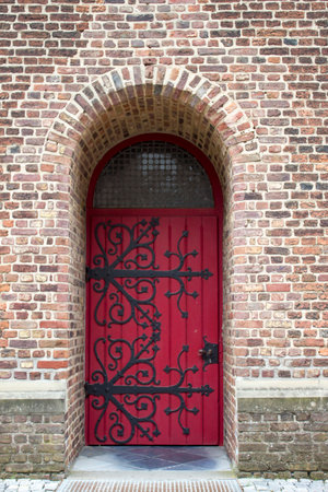Old wooden house door in German small town, Issum, North-Rhine Westphalia, Germanyの写真素材
