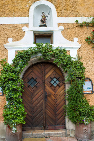 Old vintage wooden door in Hallstatt in Austriaの写真素材