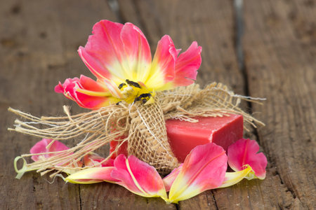 bar of natural soap and tulip flowerの写真素材