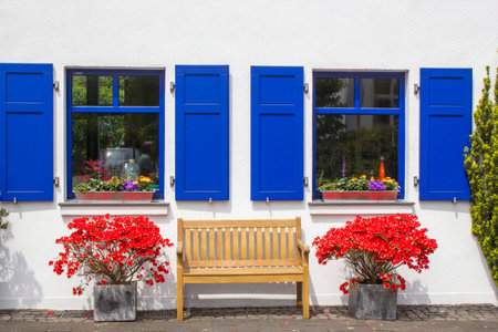 Old German house with wooden door and windows with wooden shutters, Wachtendonk, North-Rhine Westphalia, Germanyの写真素材