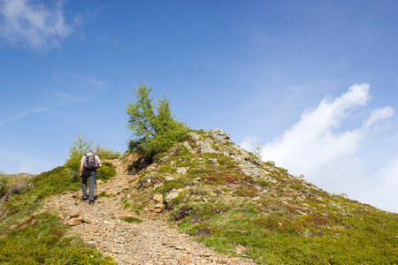 man trekking in the mountains, Alps in Austria, Lienz Dolomites, East Tyrolの写真素材