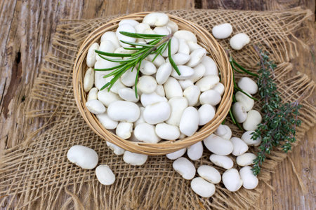 white beans and herbs in a basket - close upの写真素材