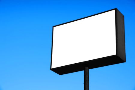 Large white blank road or freeway sign against pure blue sky, ready for advertisement.の写真素材