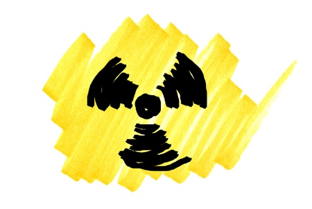 Radioactivity symbol in black and yellow ink marker scribble.の写真素材