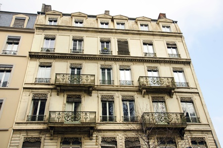 Architecture :Old building apartments or flats in a European city with beautifuly crafted wrought iron balconies.のeditorial素材