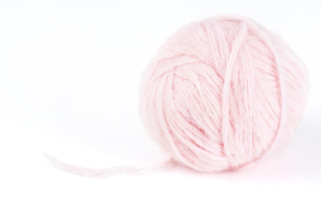 Macro shot of ball of pretty soft pale pink angora wool or yarn, great craft or baby girl background.の写真素材