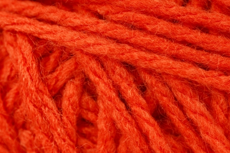 Macro shot of ball of orange wool or yarn, great colorful orange abstract background.の写真素材