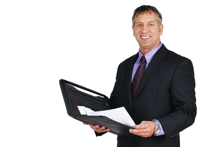 Man in suit and tie, holding paperwork and smiling, can be boss or management employee.の写真素材