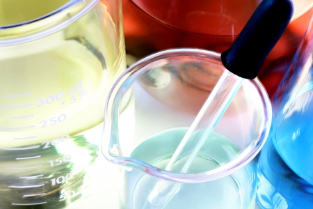 Science, research or chemistry background: interesting macro shot of laboratory glassware with colorful chemicals or liquids, stacked focus.の写真素材