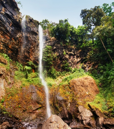 XXL Beautiful sacred waterfall with colonial observation deck deep into the thick and lush african tropical forest, great nature background.の写真素材