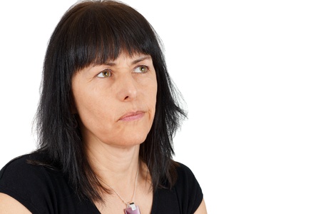 Thoughtful or wondering middle age womanの写真素材