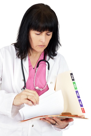 Doctor looking at medical fileの写真素材