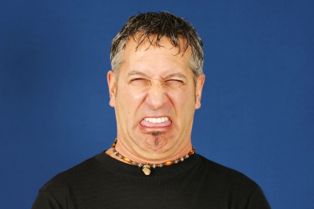 Man with funny disgusted faceの写真素材