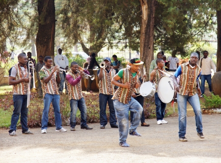 AFRICA,CAMEROON,DSCHANG - JANUARY 14: Dschang University marching band and dancers on January, 14, 2013 in Cameroon. Dschang university is the only school providing higher education in forestry and agriculture in Cameroon.の写真素材