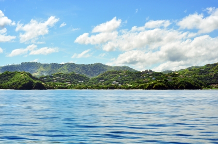 Beautiful paradise, out on the ocean looking at tropical island with jungleの写真素材