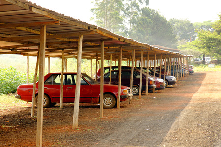Cars parked under the shade of a carport in Africaの写真素材