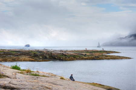 Tadoussac, CANADA- AUGUST 8, 2014: The Saguenay river empties into the St.Lawrence river at the small tourist town called Tadoussac. It is a well known whale watching area.のeditorial素材