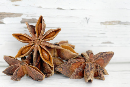 Star anise spice over old white painted woodの写真素材