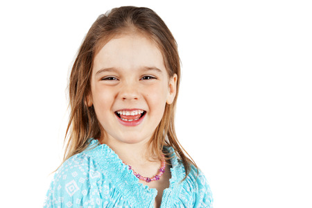 Cute and natural little blond girl laughingの写真素材