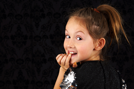 Portrait of funny little blond girlの写真素材