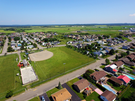Aerial of sport fields in small town with copy spaceの写真素材