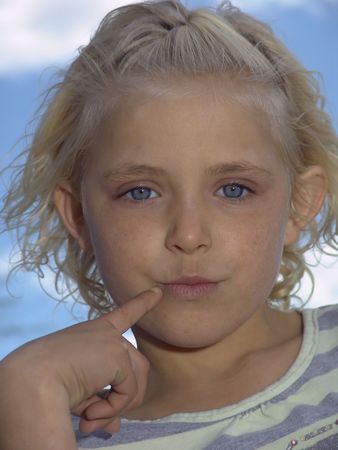 Portrait of a young blue-eyed blonde girlの写真素材
