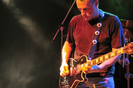 Guitarist performing on stageの写真素材