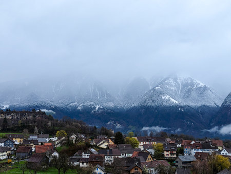 View of the village on the background of mountains. Panoramic view of foggy morning. view from the...