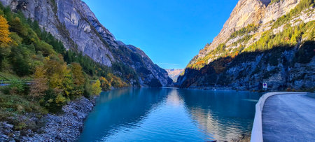 Panoramic view of alpine lake in autumn, Switzerland.